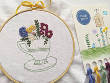Load image into Gallery viewer, Teacup embroidery kit includes hoop, DMC thread, stitch instructions, needle and thread organizer. Pattern iron on ready to go linen fabric. Easy and fun.