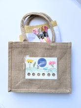 Load image into Gallery viewer, Jute bag embroidery kit includes cotton fabric and DMC thread.
